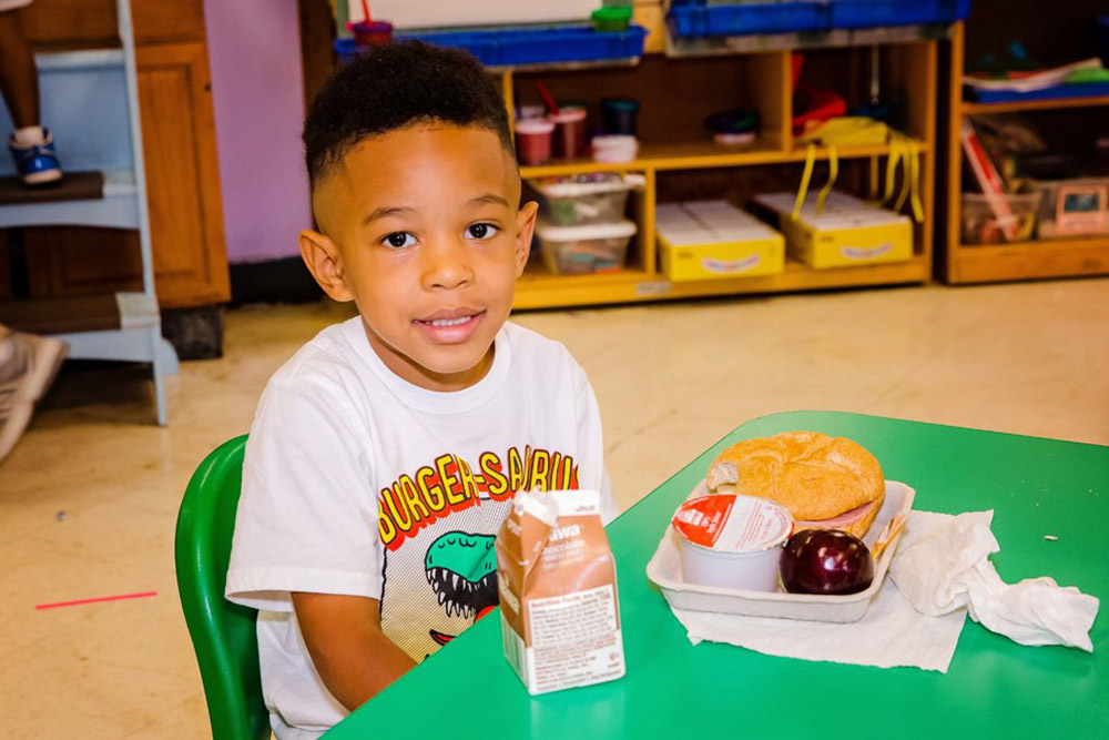 LMP-20210629-FBSNJ-Camden-Kids-014F-1024x683 Smiling boy in school with his lunch