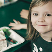 Child3a smiling girl with her lunch
