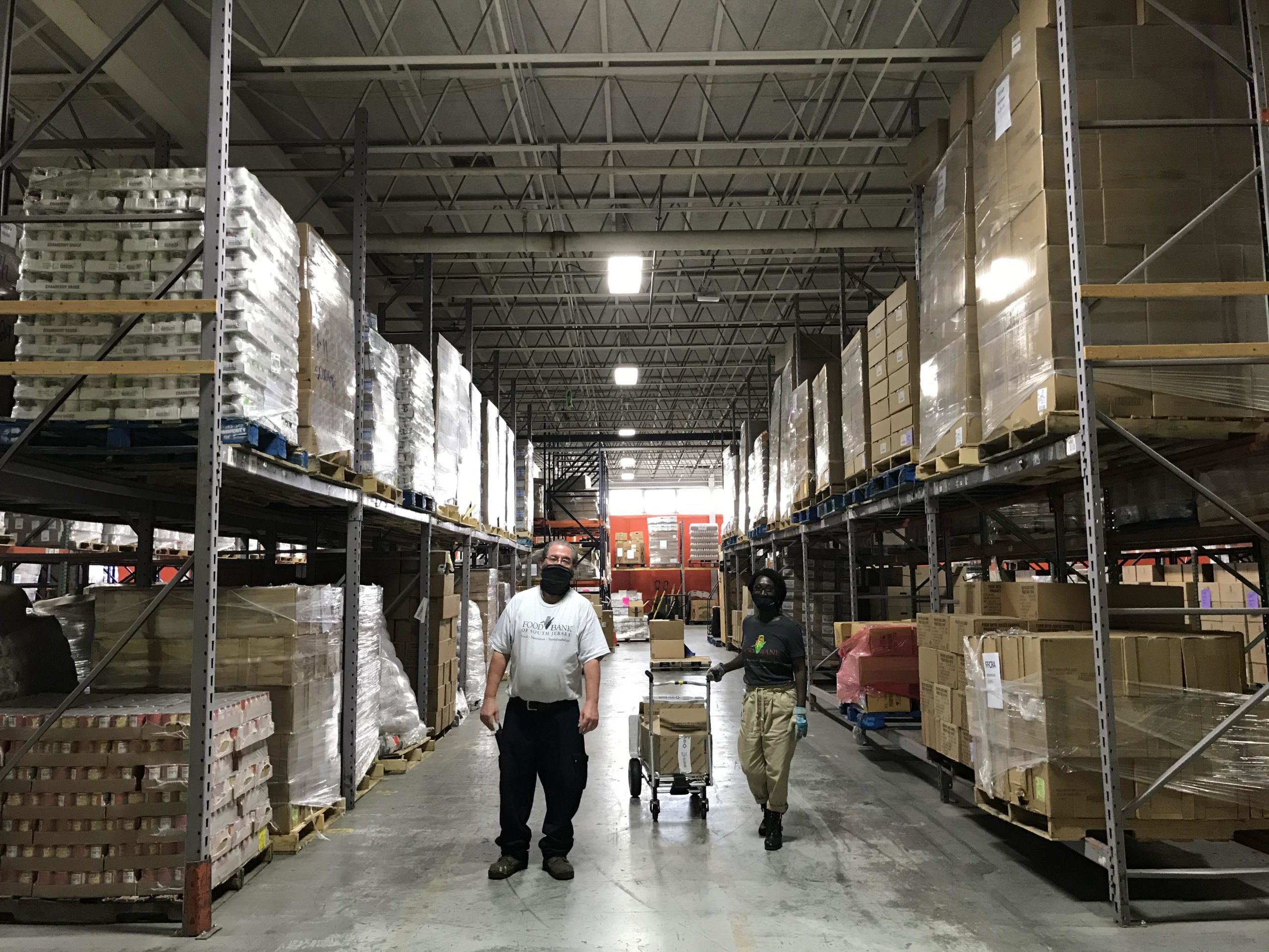 Image-copy-scaled Two people in a warehouse full of food