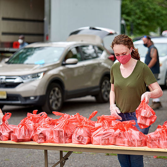 pop-up-pantry volunteers with bags of food donations