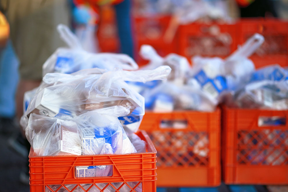 Purchasing-Food bags of milk cartons in crates