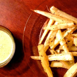 Yucca fries on a plate with dipping sauce